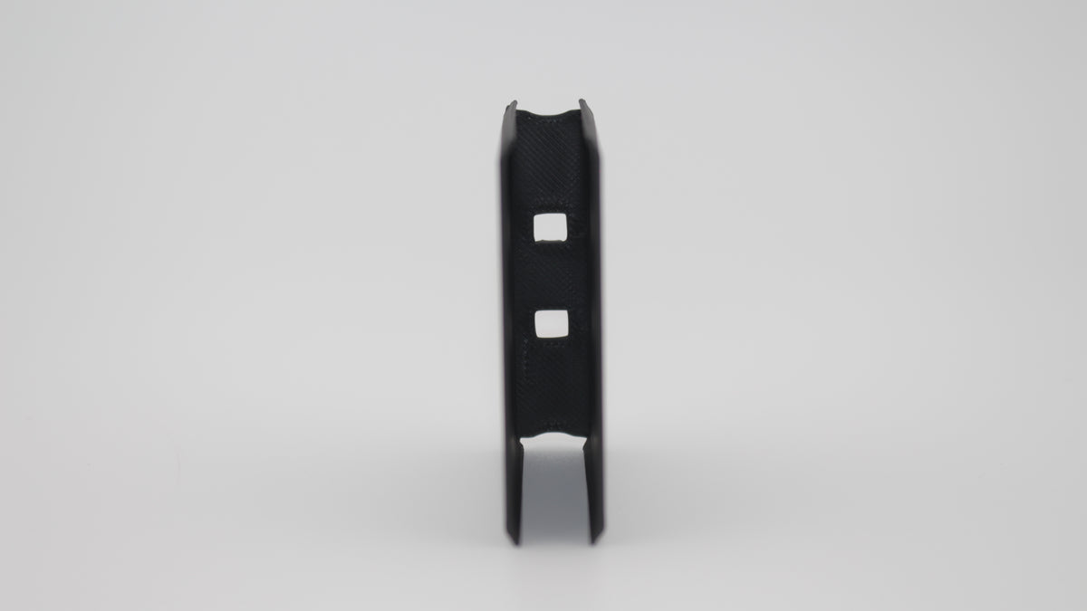 Front view of black en-bloc clip for Gewehr 88 Commission Rifle with narrow open slot design and symmetrical side flanges, displayed on a light grey background.