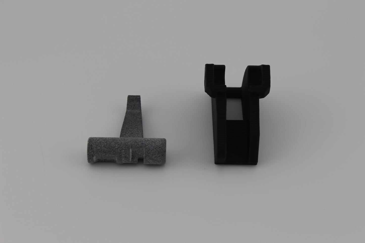 Hoffman Tactical 3-position super safety MJF 3D-printed cam and lever components displayed on gray background