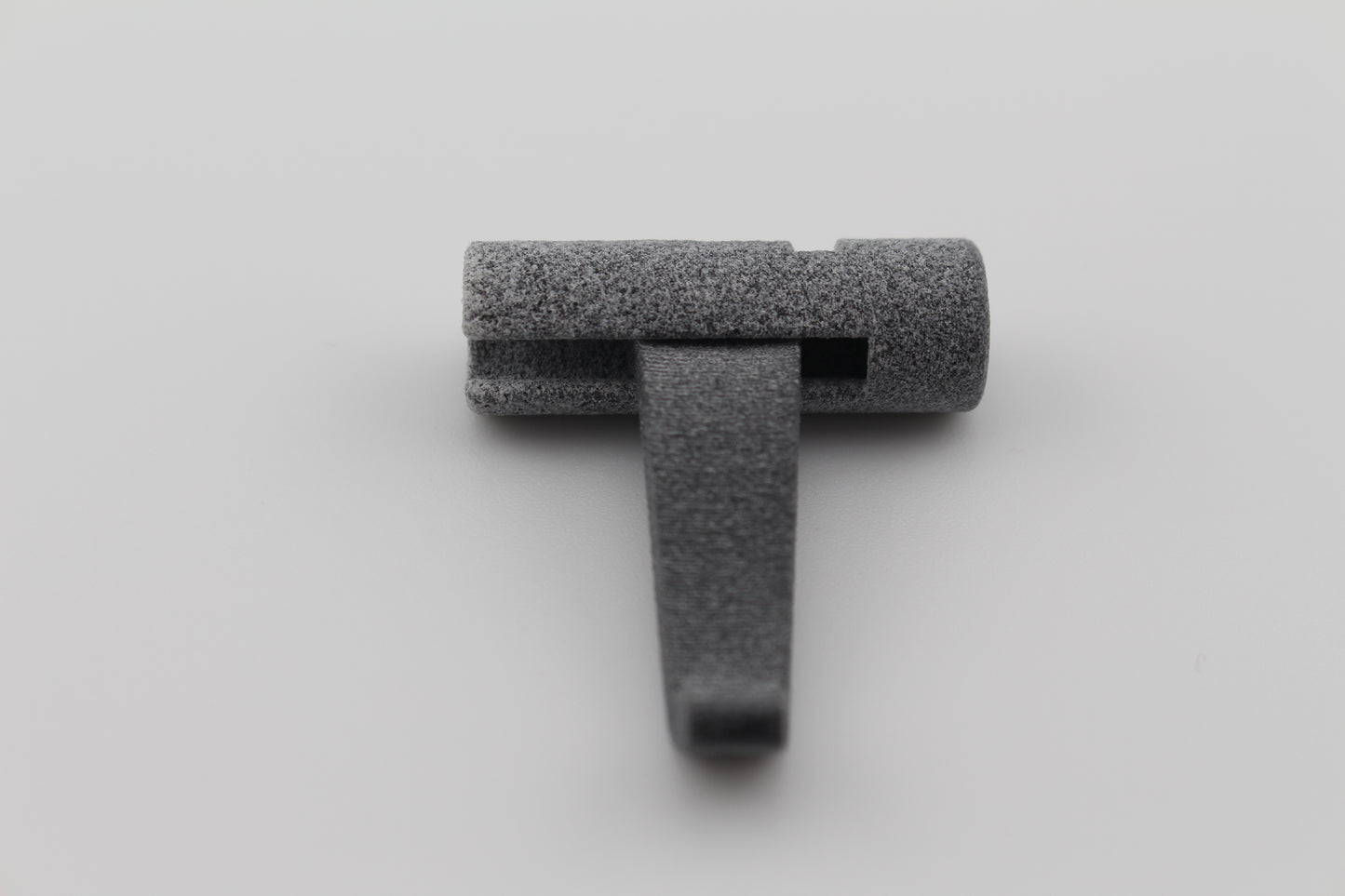 MJF 3D ‑printed lever component for Hoffman Tactical 3 ‑position super safety assembly on light gray background