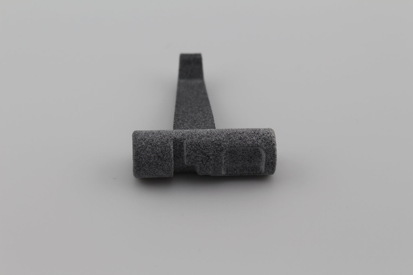 MJF 3D-printed lever with cylindrical end for Hoffman Tactical 3-position super safety on light gray background