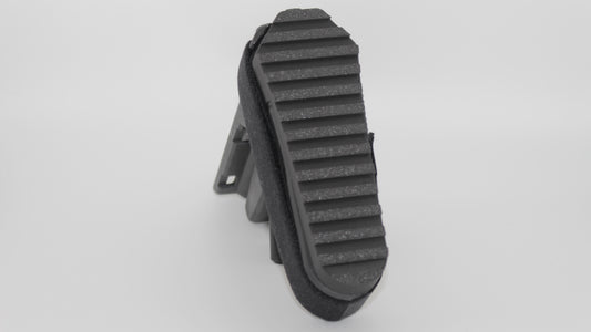 Rear angled view of black 3D-printed SBA3 full-length Devoid plug installed in the SBA3 brace, showing ribbed rear surface and integrated body, displayed on a light grey background.