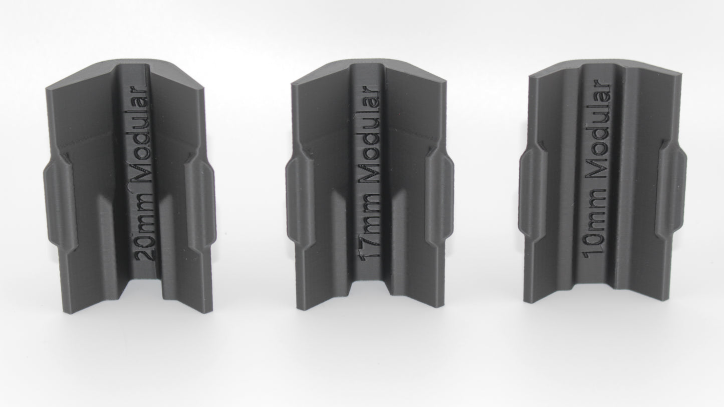 Bottom view of three black modular SBA4 cheek riser inserts labeled 20mm Modular, 17mm Modular and 10mm Modular, aligned upright on a white background.