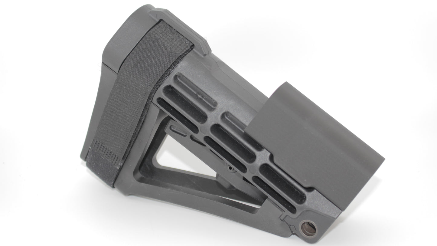 Side view of SBA4 modular cheek riser in the highest mounting position on the SBA4 brace, featuring black riser at its tallest height with skeletonized brace design, displayed on a light grey background.
