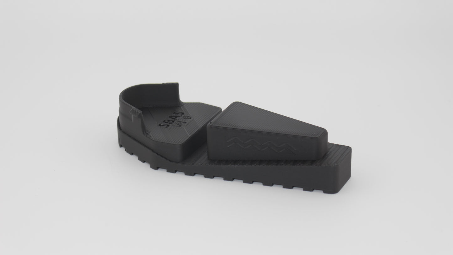 Side view of black SBA5 full-length Devoid plug by itself, featuring tapered top wedge and contoured base with integrated ribbing, displayed on a light grey background.