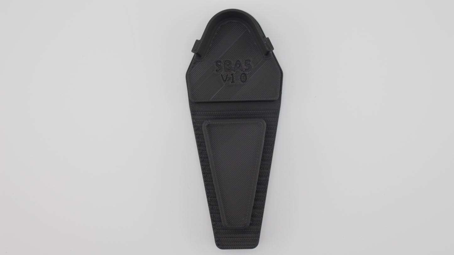 Top-down view of black SBA5 full-length Devoid plug showing tapered front wedge and recessed rectangular panel with embossed "SBA5 V1.0" marking, displayed on a light grey background.