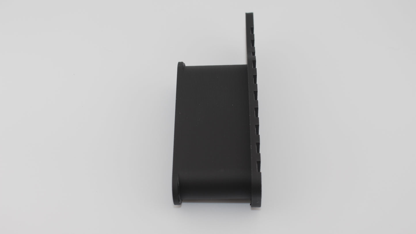 Profile view of black full‑length Devoid plug for CAA MCK micro conversion kit, showing slim side profile with curved body and grooved base against light gray background