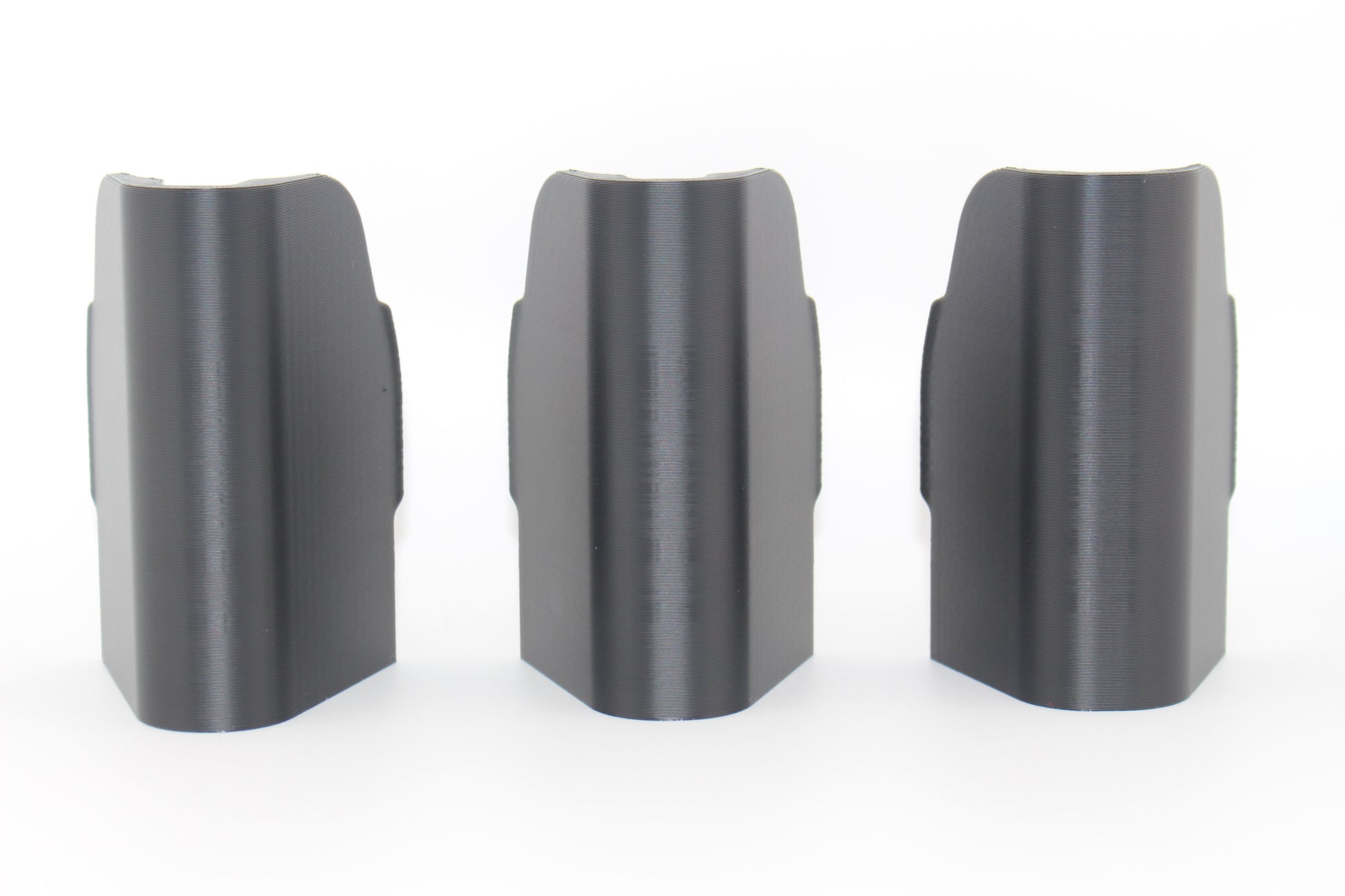 Top surfaces of three SBA5 cheek riser inserts representing 10mm, 17mm and 20mm heights displayed upright on white background