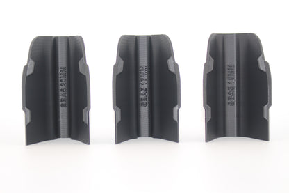 Three black SBA5 cheek riser inserts in 10mm, 17mm and 20mm heights displayed upright from bottom view on white background