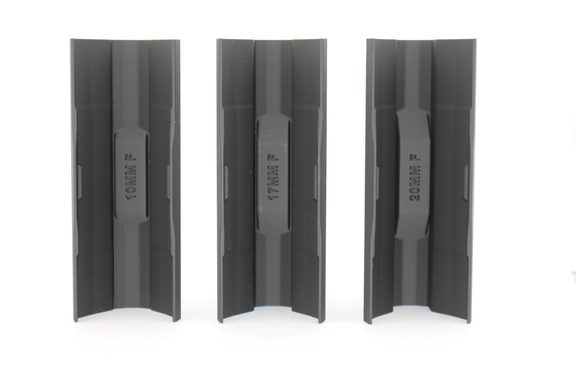 Three black full‑size SBA3 cheek riser inserts in 10mm, 17mm and 20mm heights displayed upright from bottom view on white background