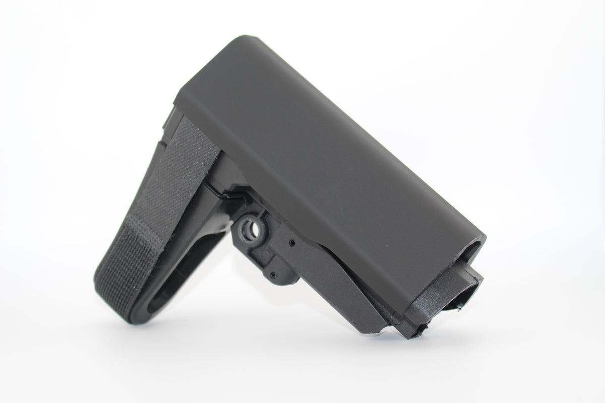Black polymer full‑size SBA3 cheek riser attachment shown in side view on an SBA3 stabilizing brace on white background