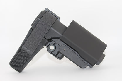Side view of black half-size SBA3 cheek riser attached to the SBA3 brace in an elevated position, showing contoured riser with Velcro strap on a white background.