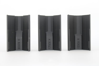 Bottom view of three black half-size SBA3 cheek riser inserts labeled 20mm, 17mm and 10mm, showing underside profiles and mounting channels, displayed on a white background.