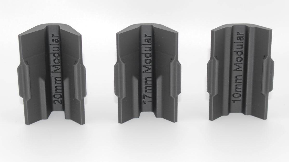 Bottom view of three black modular SBA4 cheek riser inserts labeled 20mm Modular, 17mm Modular and 10mm Modular, aligned upright on a white background.
