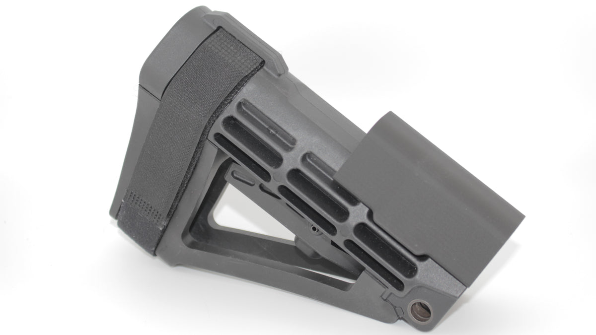 Side view of SBA4 modular cheek riser in the highest mounting position on the SBA4 brace, featuring black riser at its tallest height with skeletonized brace design, displayed on a light grey background.